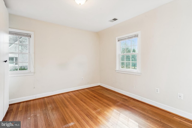 spare room featuring hardwood / wood-style flooring