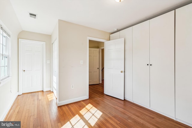 unfurnished bedroom with light hardwood / wood-style floors