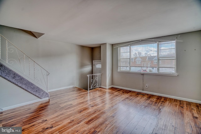 unfurnished living room featuring light hardwood / wood-style floors