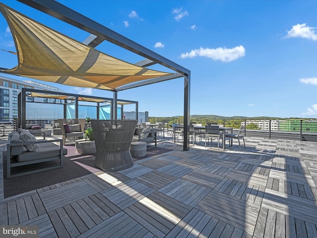 wooden deck featuring an outdoor living space and a pergola