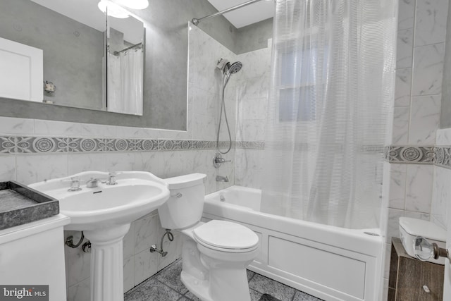 full bathroom featuring toilet, tile walls, and shower / tub combo with curtain