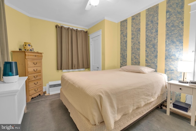 carpeted bedroom featuring a ceiling fan and crown molding