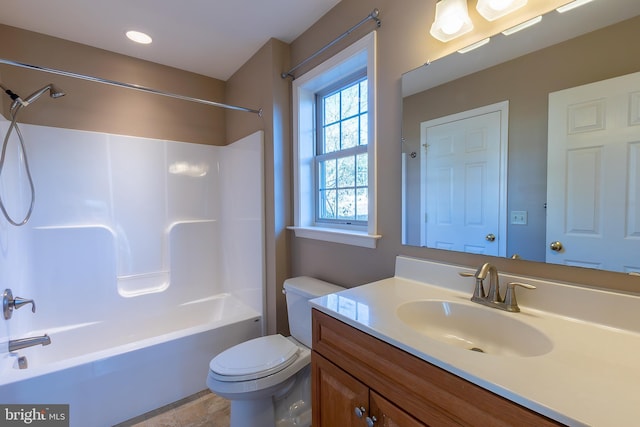 full bath featuring vanity, toilet, and washtub / shower combination