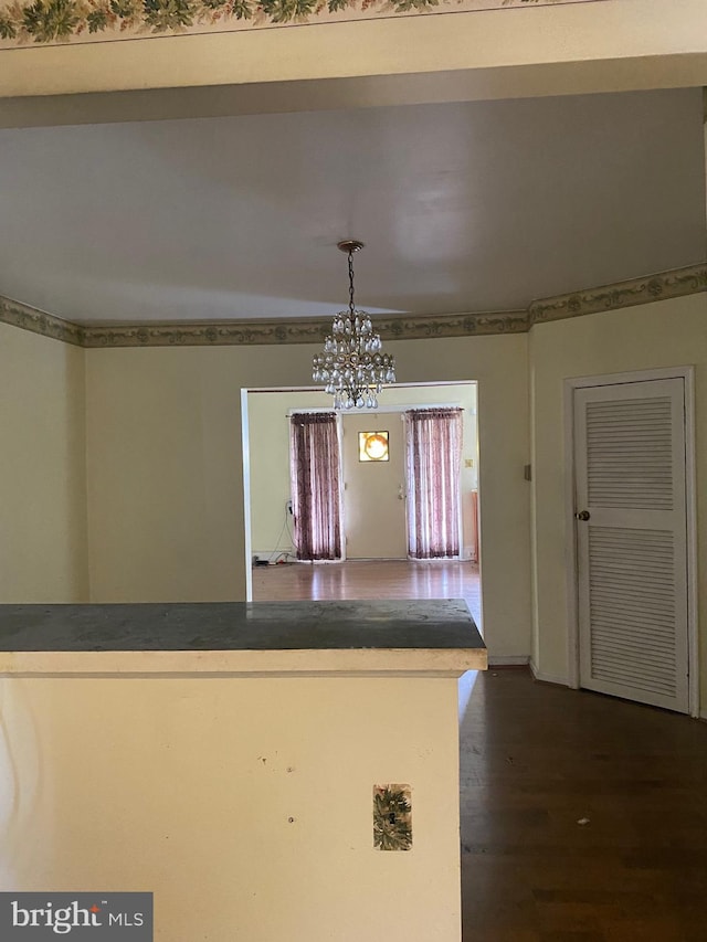 kitchen featuring a chandelier, dark hardwood / wood-style floors, and decorative light fixtures