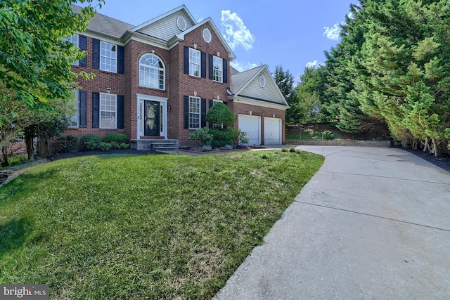 view of front of house with a garage and a front yard