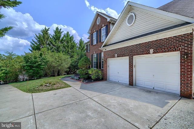 5816 Rockburn Woods Way, Elkridge, MD 21075 - view of side of home with a garage and a lawn