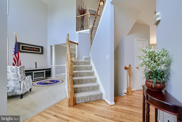 5816 Rockburn Woods Way, Elkridge, MD 21075 - stairs with hardwood / wood-style flooring and a high ceiling