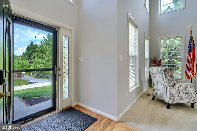 5816 Rockburn Woods Way, Elkridge, MD 21075 - entrance foyer featuring hardwood / wood-style flooring, a towering ceiling, and a wealth of natural light