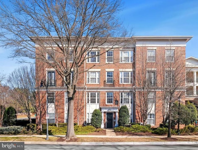 view of front of house with brick siding