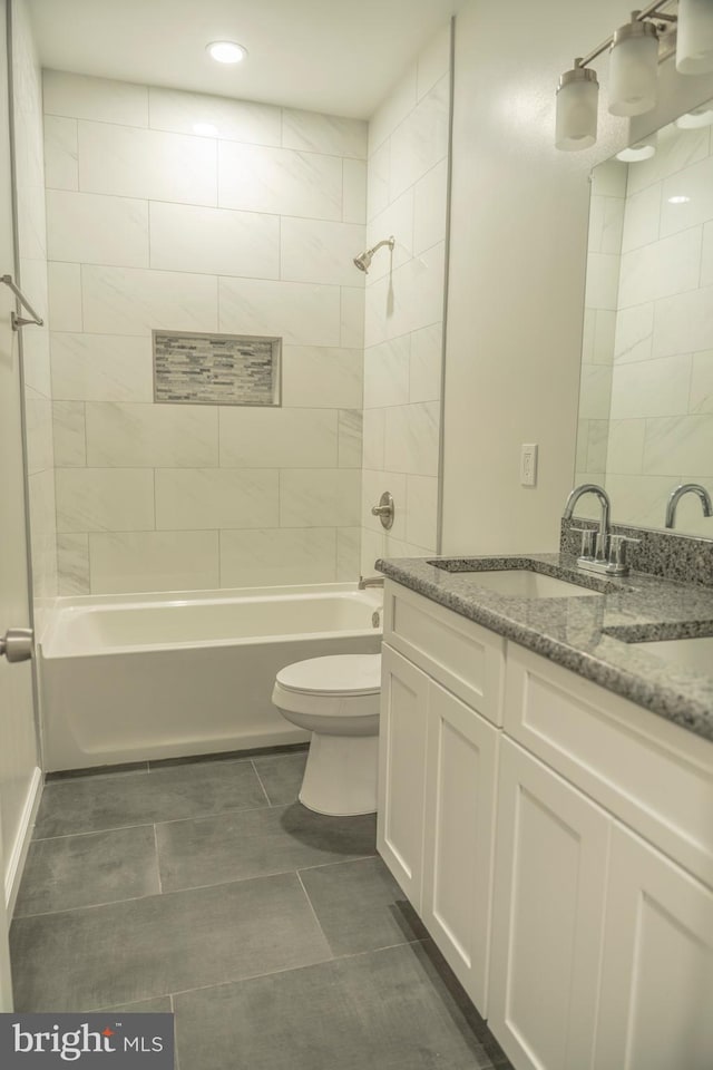 full bathroom with  shower combination, toilet, and vanity