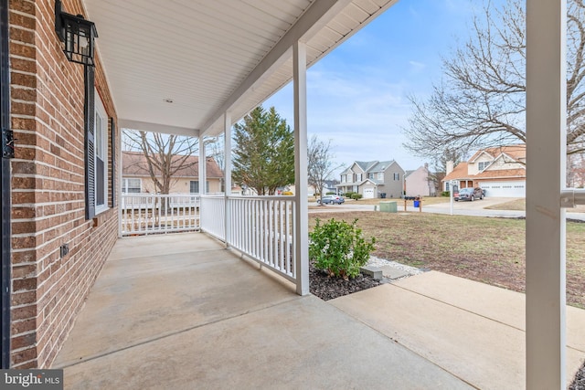 view of patio / terrace featuring covered porch and a residential view