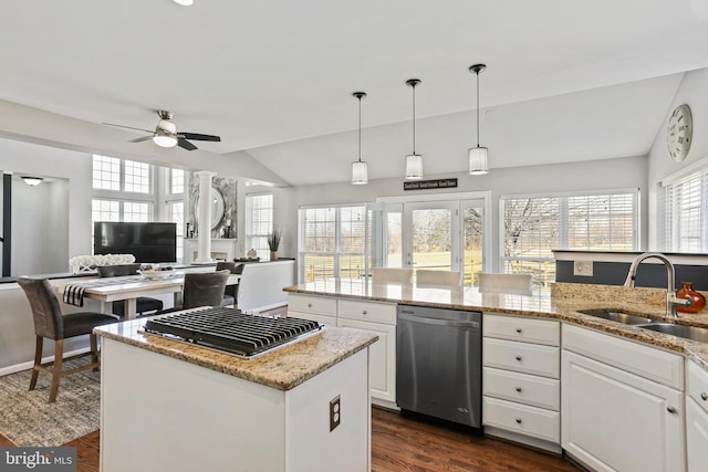 kitchen featuring a sink, white cabinetry, light stone counters, and dishwasher