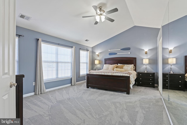 bedroom featuring lofted ceiling, light carpet, visible vents, and baseboards