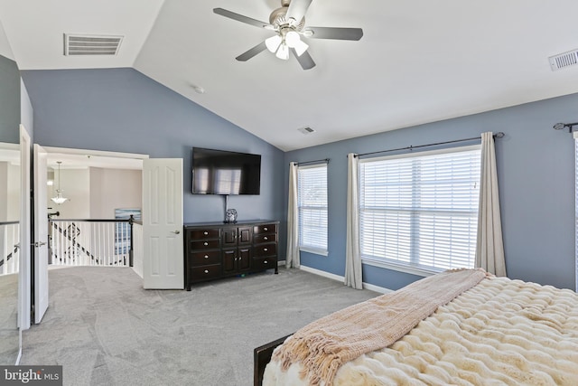 bedroom featuring light carpet, visible vents, and lofted ceiling