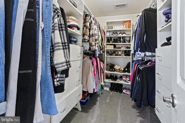 spacious closet with carpet flooring and visible vents