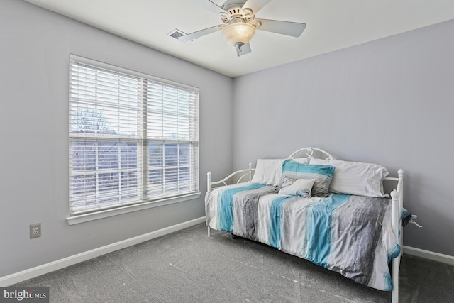 bedroom featuring ceiling fan, visible vents, baseboards, and dark colored carpet