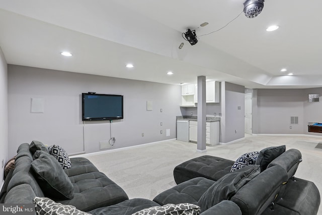 living room with baseboards, visible vents, and recessed lighting