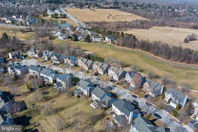 aerial view featuring a water view and a residential view