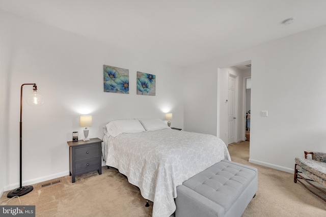 bedroom with light colored carpet