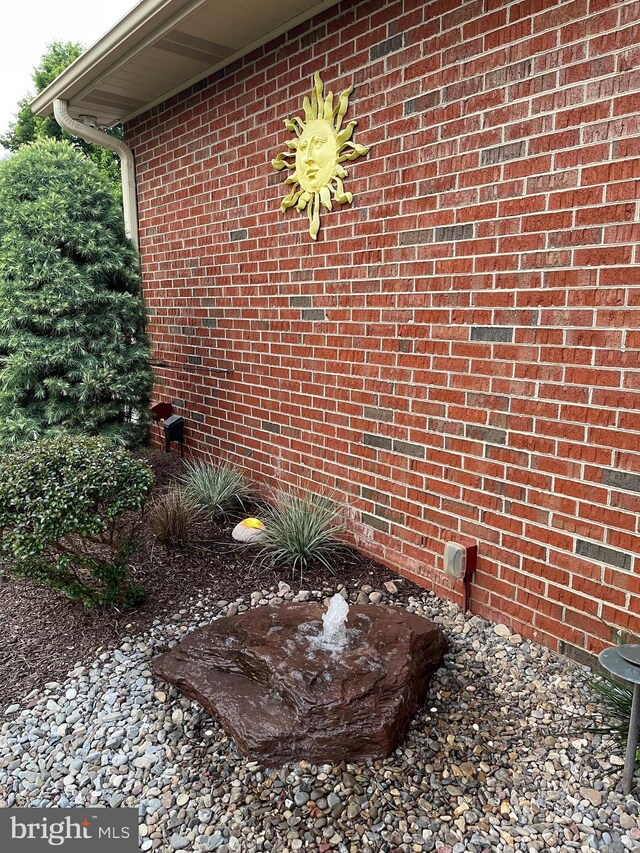 exterior space featuring crawl space and brick siding