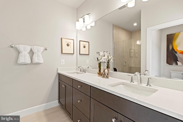 bathroom with vanity, toilet, and walk in shower