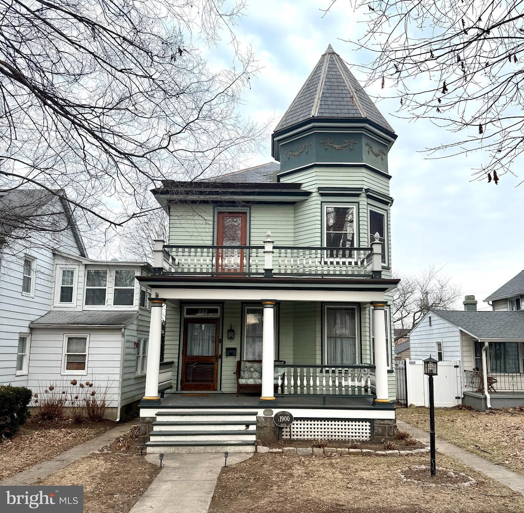 victorian-style house featuring a porch