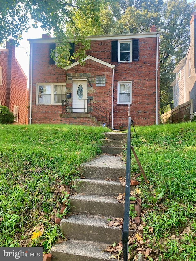 view of front of home with brick siding