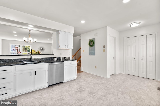 kitchen with dark stone countertops, sink, dishwasher, decorative light fixtures, and white cabinets