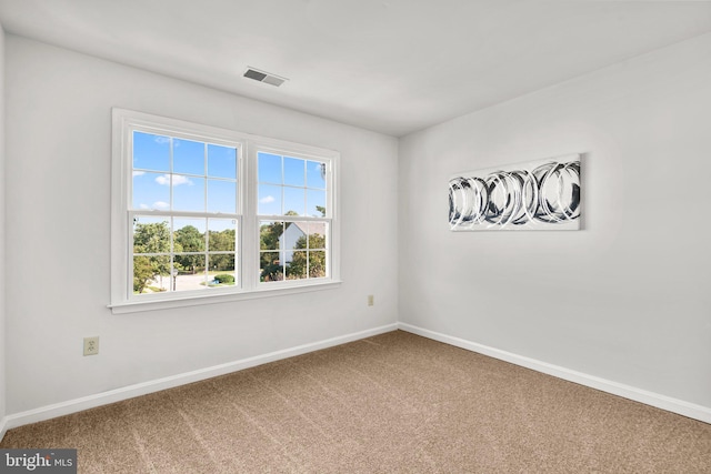 empty room featuring carpet flooring