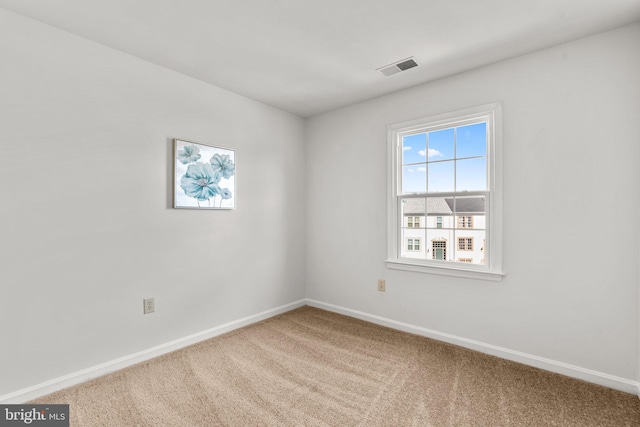 unfurnished room with carpet floors