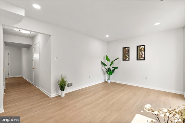 spare room with light wood-type flooring