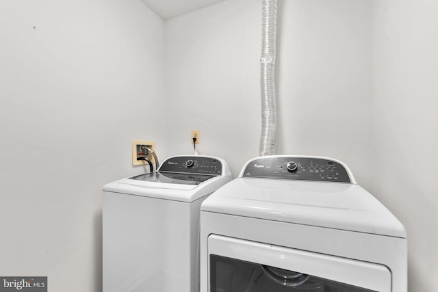 laundry room featuring separate washer and dryer