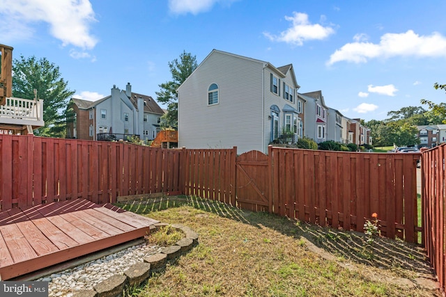 view of yard featuring a wooden deck