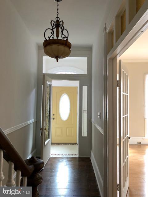 foyer with dark hardwood / wood-style flooring