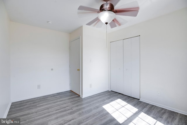 40 Smokewood Ct Unit 200, Stafford, VA 22554 - unfurnished bedroom with a closet, ceiling fan, light wood-style flooring, and baseboards