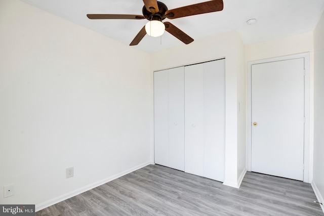 40 Smokewood Ct Unit 200, Stafford, VA 22554 - unfurnished bedroom featuring light wood-style floors, ceiling fan, baseboards, and a closet