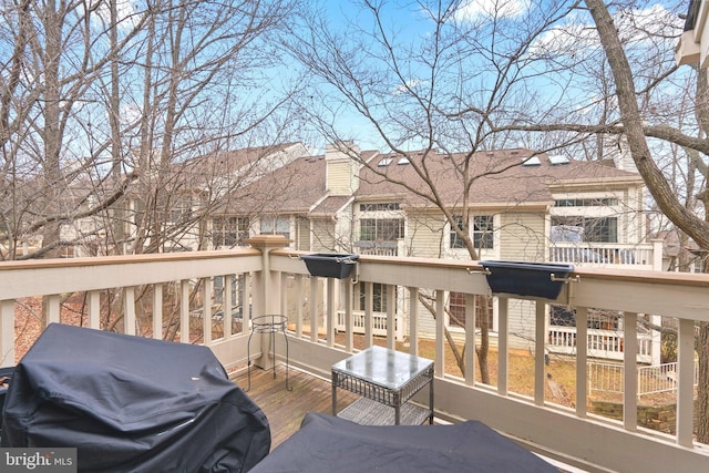 wooden deck featuring area for grilling