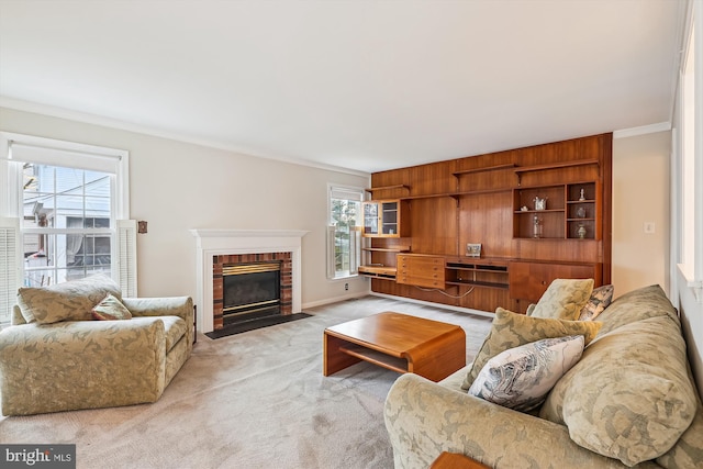 living room with ornamental molding, light colored carpet, and a fireplace