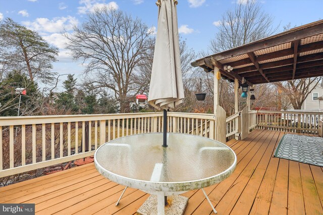 wooden deck with outdoor dining space
