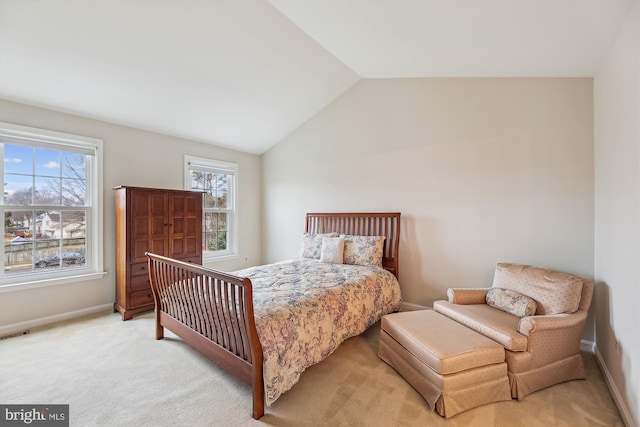 bedroom featuring vaulted ceiling, carpet, visible vents, and baseboards