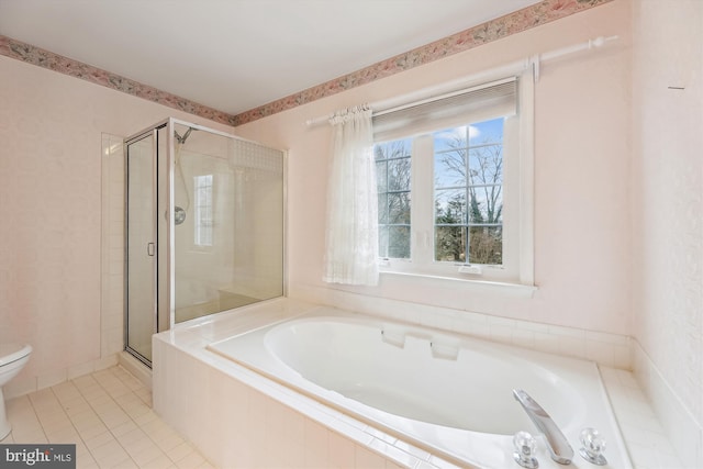 bathroom with tile patterned flooring, a garden tub, a shower stall, and toilet