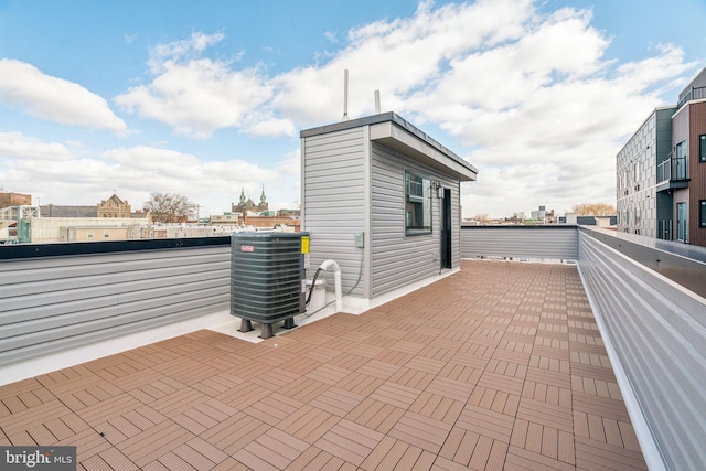 view of patio / terrace with a balcony and central air condition unit