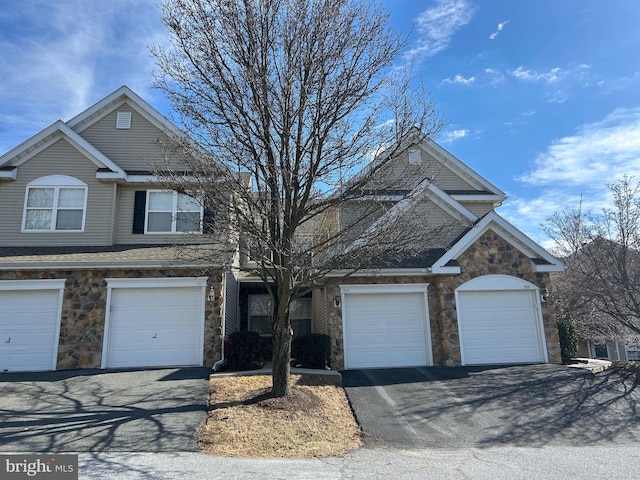 front facade with a garage