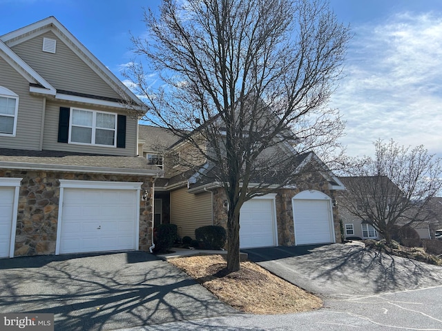 front of property with a garage