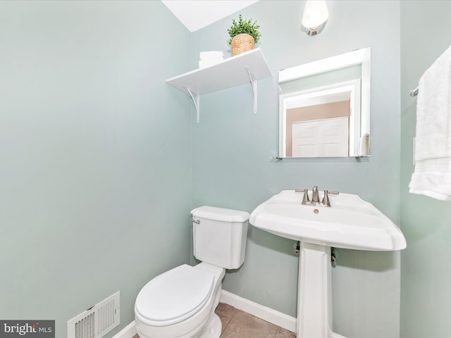 bathroom with tile patterned floors and toilet