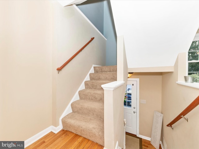 stairs with wood-type flooring