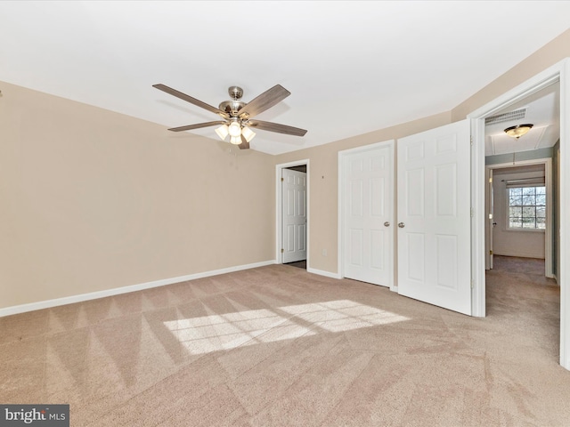 unfurnished bedroom featuring ceiling fan, light carpet, and a closet