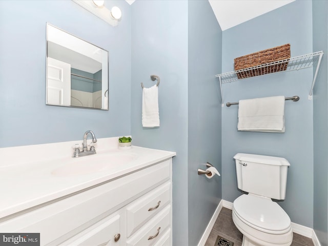 bathroom with tile patterned floors, toilet, and vanity