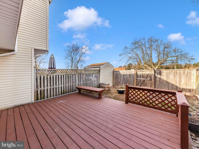 wooden terrace with a shed