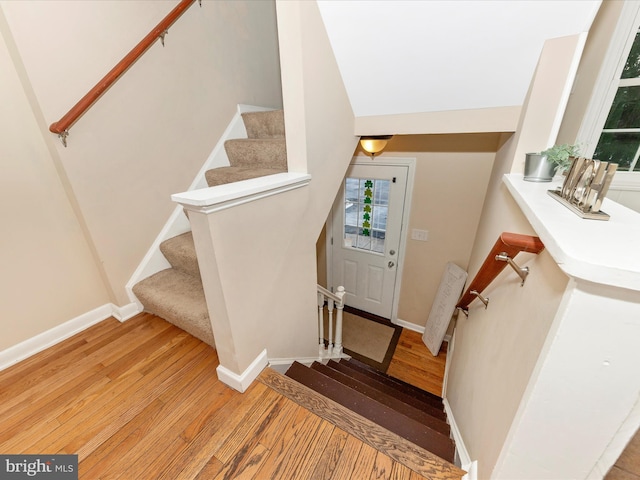 stairs with hardwood / wood-style floors